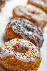 Closeup of freshly baked colorful donuts