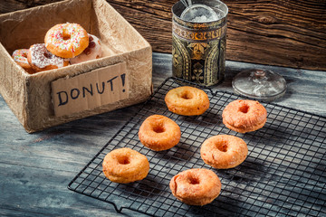 Preparing to decorate donuts with icing sugar