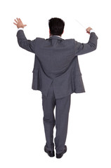 Businessman Directing With A Conductor's Baton