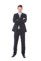 Confident Businessman With Arm Crossed