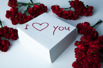 notebook with marker inscription I love you and roses