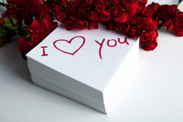 notebook with marker inscription I love you and roses