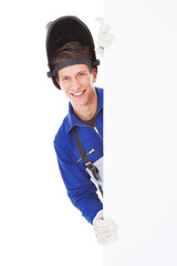 Male Welder Holding Placard