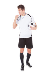 Soccer Referee Holding Football