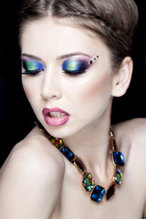 beautiful model wearing blue make-up - studio shot on black