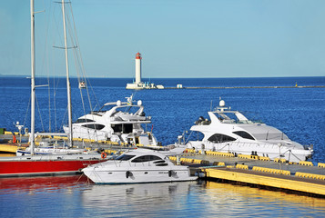 Fototapeta premium White motor yacht over harbor pier, Odessa, Ukraine