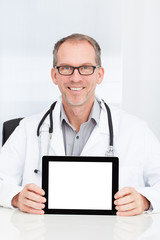 Doctor Showing Digital Tablet