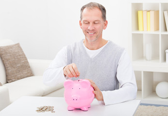 Man Holding Piggybank
