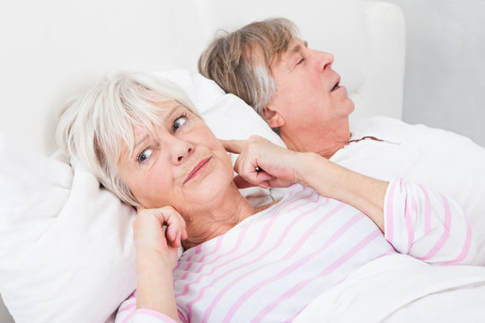 Woman Disturbed With Man Snoring