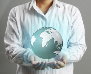 holding a glowing earth globe in his hands