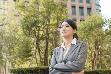 Asian business woman thinking in the city