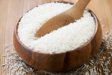 Close-up of a wooden bowl with raw basmati rice