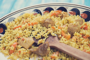 Close-up of pilaf with pork meat, horizontal shot
