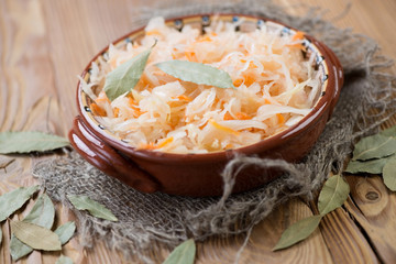 Sauerkraut with dried bay leaves, horizontal shot