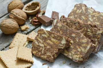 Homemade cake with chocolate nuts and biscuits