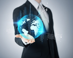 businessmans hand showing earth globe