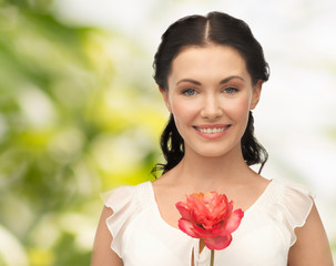 young and beautiful woman with flower