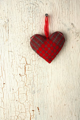 Red  heart  hand made on a  old wooden door
