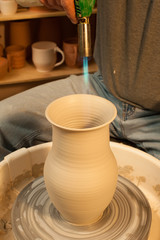 Making a pitcher. Pottery. Finish