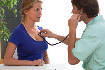 Cardiologist testing a patient