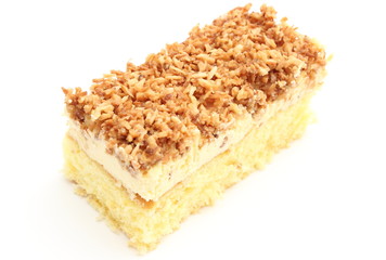 Sponge cake with cream and coconut. White background