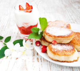fresh strawberries  pancakes and yogurt
