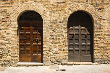 Closed doors of a building in the medieval town of San Gimignano