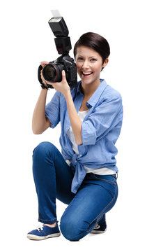 Woman-photographer takes snaps, isolated on white 