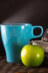 Hot Coffee in Light Blue cup and apple