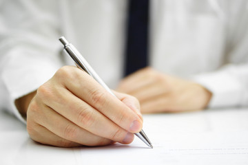 businessman is signing agreement