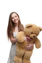girl holding soft toy bear