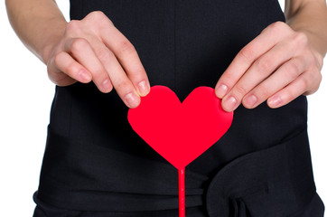 female hands holding heart out of pape