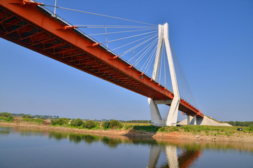 a big red and white bridge through the river Oka - Powered by Adobe