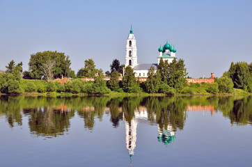 cathedral with bell tower and his reflection in water