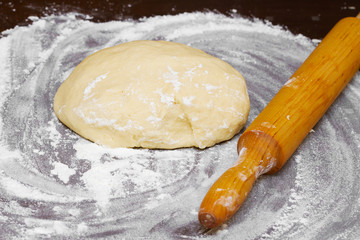 dough and wooden rolling pin