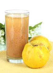 Sweet quince with juice on table on white background