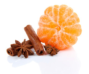 Ripe sweet tangerine and spices, isolated on white