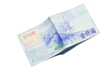 A 1000 New Taiwan Dollars bill on white background