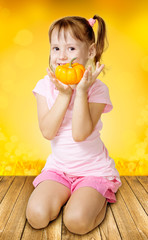 Girl holding pumpkin