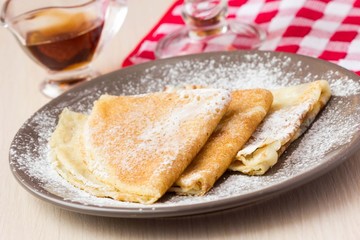 Thin sweet pancakes, powdered sugar for Breakfast, Shrovetide