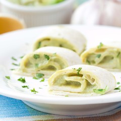 Rolls wrapped bread, tortilla, pita stuffed with avocado cream