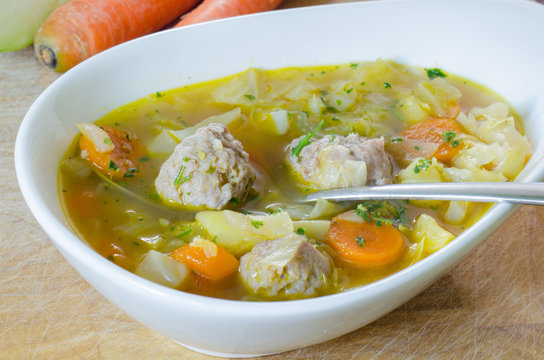 Asian soup with meatballs and vegetables