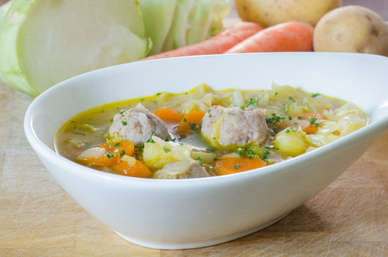 Asian soup with meatballs and vegetables