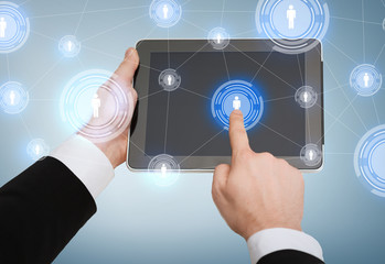 close up of man hands touching tablet pc