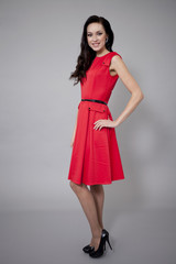 Fashion model in long red dress