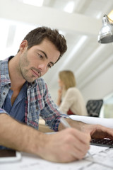 Fototapeta premium Architect working on construction budget