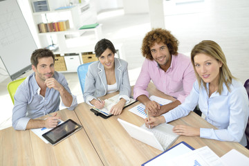 Business people meeting around table