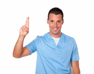 Fototapeta premium Handsome male nurse with luck sign