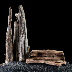 Slab resting on a pile of black rocks