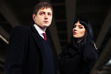 Young fashionable couple under highway road intersection